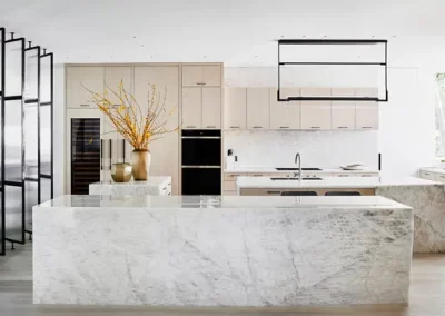 Large marble island and countertop in kitchen