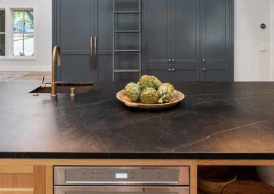 Soapstone countertop and kitchen faucet